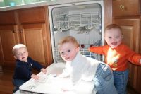 Triplets Helping with Dishes