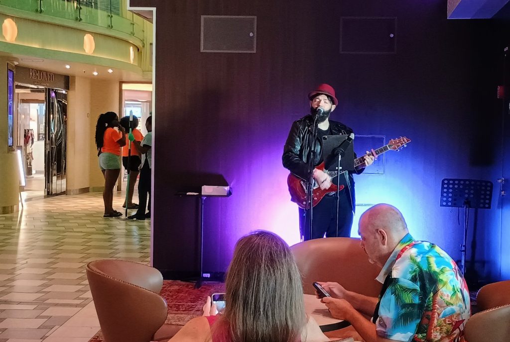Kraig Whitesail singing on the Carnival Mardi Gras